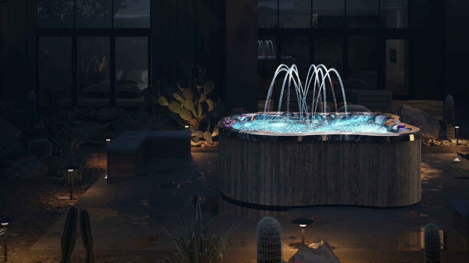 Whirlpool Amore Bay mit Wasserspiel beleuchtet in der Nacht